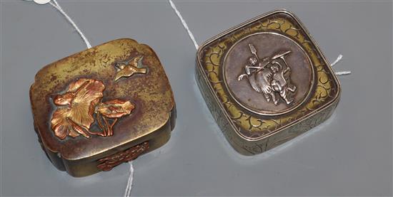 Two small Japanese decorative metal boxes with hinged covers,